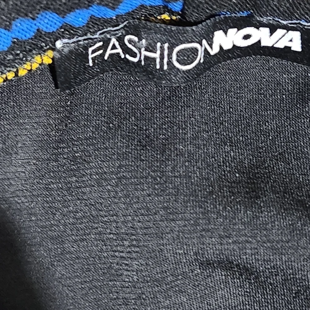 Fashion Nova Black and Gold Geometric Mesh Leggings. Size M.